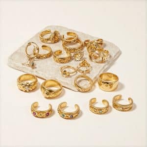 Organized display of gold adjustable rings with various minimalist designs