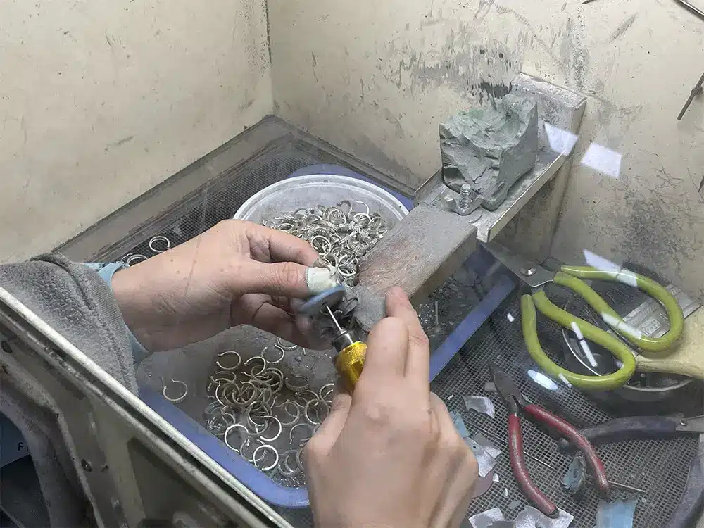 Hand finishing process in jewelry manufacturing