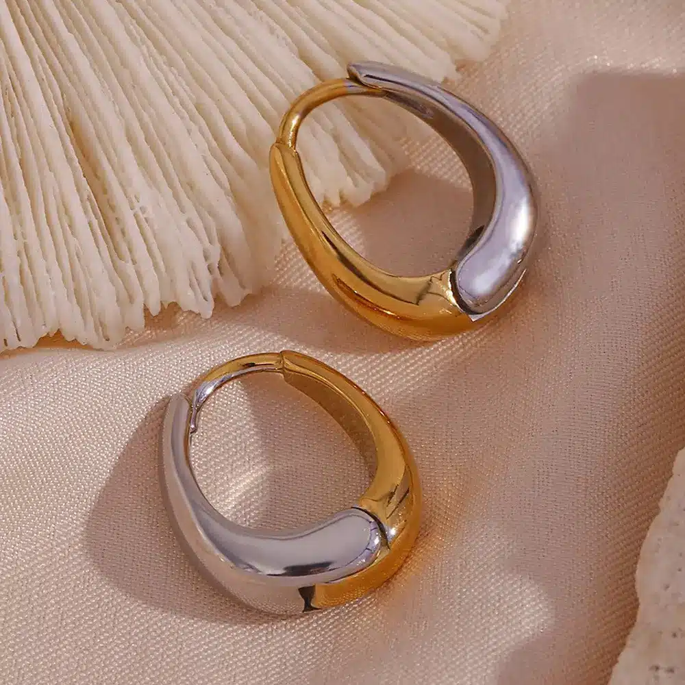 Minimalist silver tone open hoop earrings with geometric curved design
