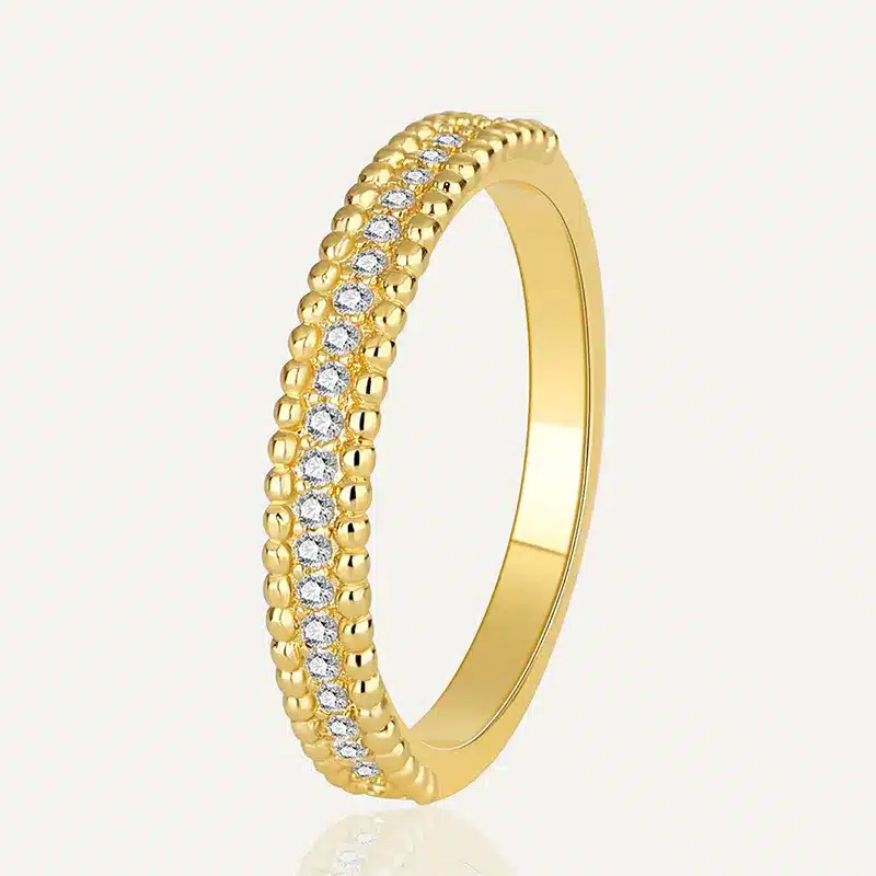 Gold band ring with intricate design