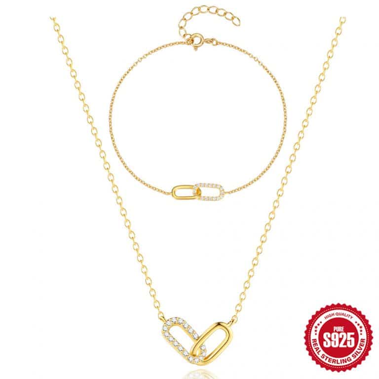Gold jewelry set featuring a heart-shaped pendant necklace and matching bracelet with adjustable chain