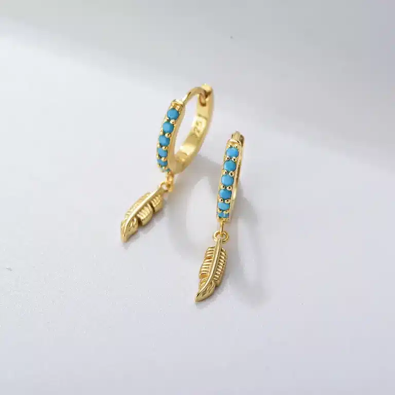 Gold lightning bolt stud earrings with crystals