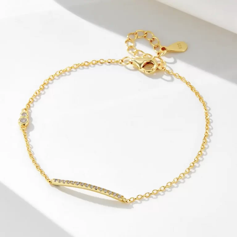 Minimalist gold bracelet with bar charm