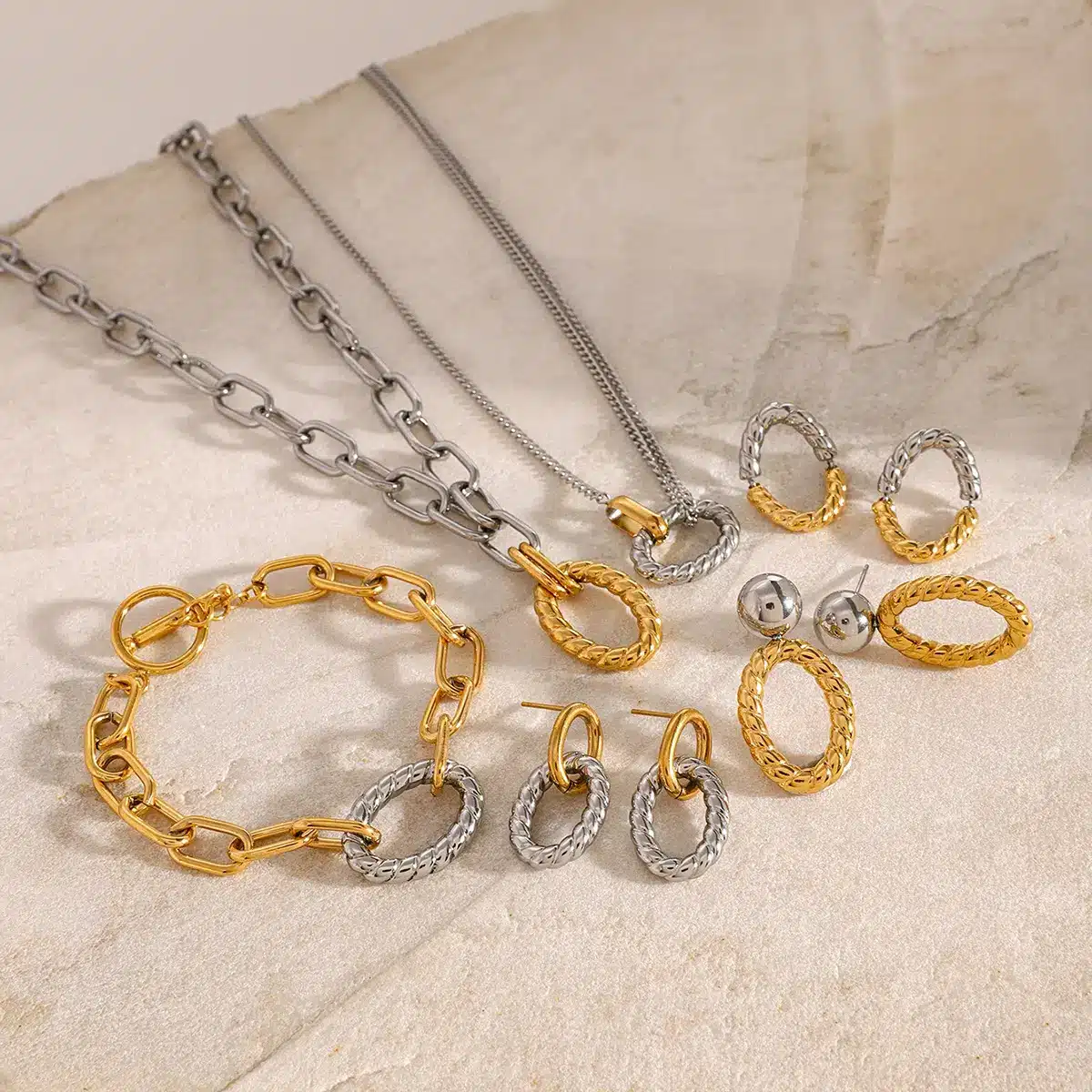 Elegant pearl and crystal charm bracelet set in silver and gold tones