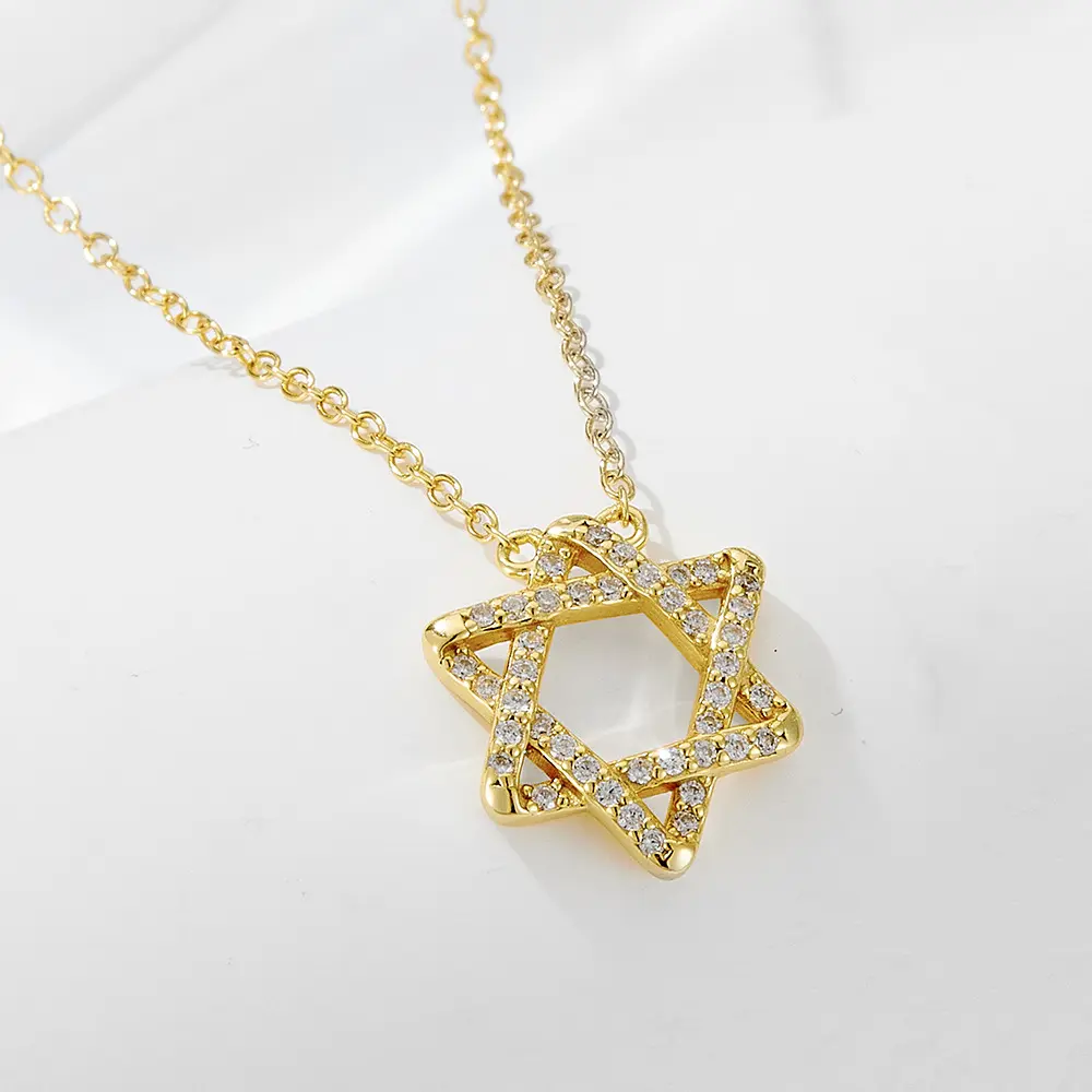 Gold necklace with star-shaped charm and crystal