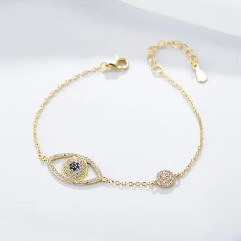 Gold bracelet with evil eye and crystal accents