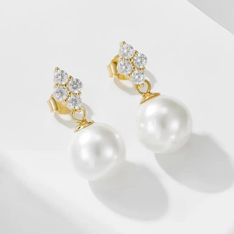 Gold star stud earrings with pearl drops