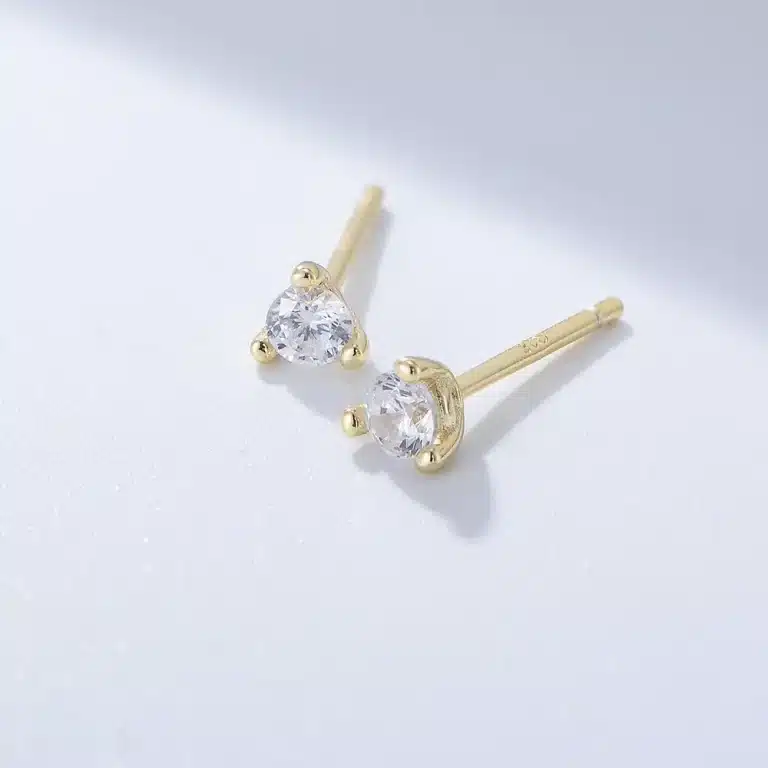 Gold lightning bolt stud earrings with crystals