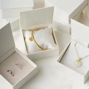 White box with gold bracelet and ring