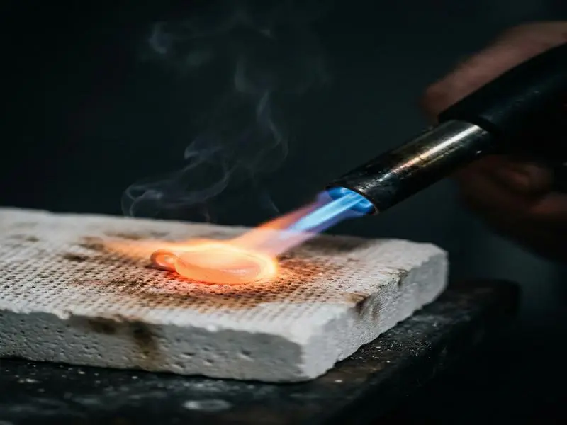 Silver Clay: The Complete Beginner's Guide to Making Real Silver Jewelry at Home 4 silver clay torch firing technique closeup 5310bb8c3f6540f6866e879874a0a089