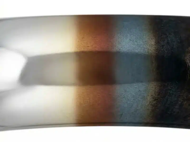 Does Silver Tarnish? The Complete Truth & Fix Guide (2026) 2 silver tarnish color stages close up e56c603b228444658583b6f33534cfe4