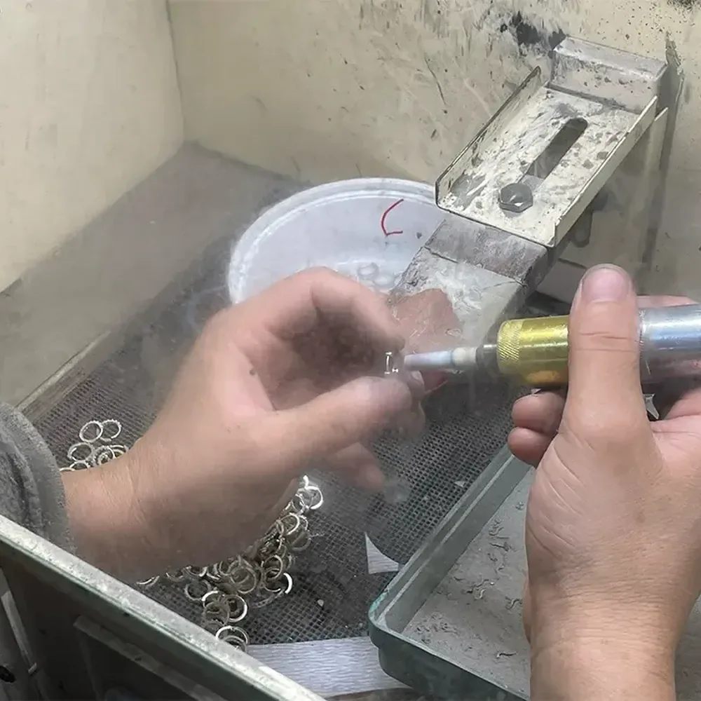 Jewelry Polishing Techniques: Cleaning, Refinishing and Care 1 Close bench finishing of small ring-shaped jewelry components
