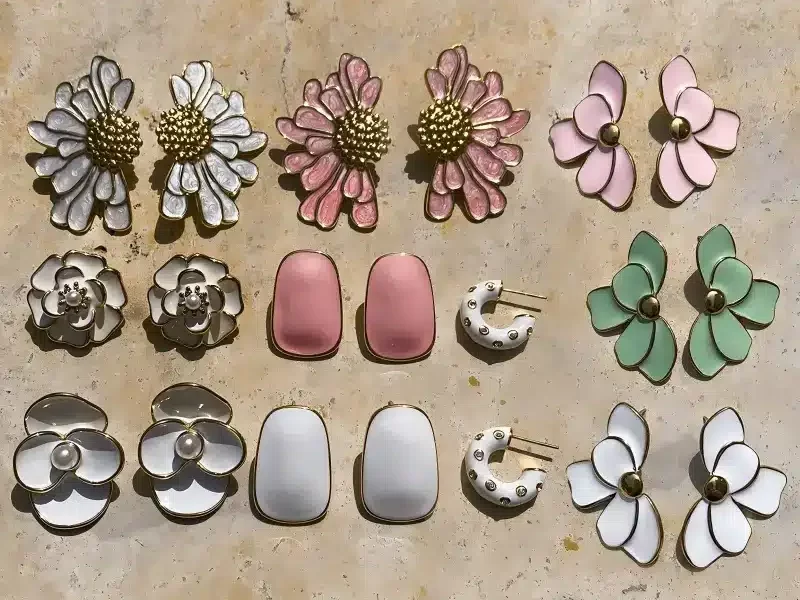 Collection of colorful custom enamel charms including rainbow, heart, and boba tea designs - Wholesale Enamel Jewelry Manufacturer