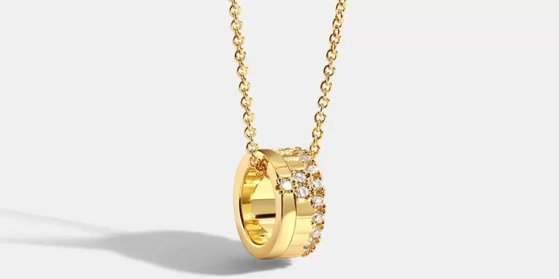 necklace supplies wholesale Gold-plated copper necklace with a pendant featuring a floral motif