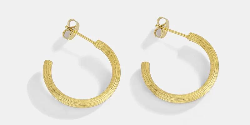 Custom Designed Earrings Gold-plated copper hoop earrings with pearl accents and a minimalist design